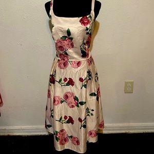 Floral tea length vintage reproduction dress w/ pink and berry colored flowers